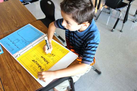 A young student completing his page's information.
