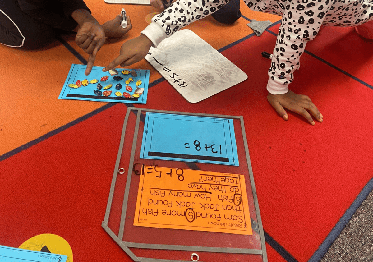 students at a math center working on unknown numbers for addition and subtraction in second grade. 