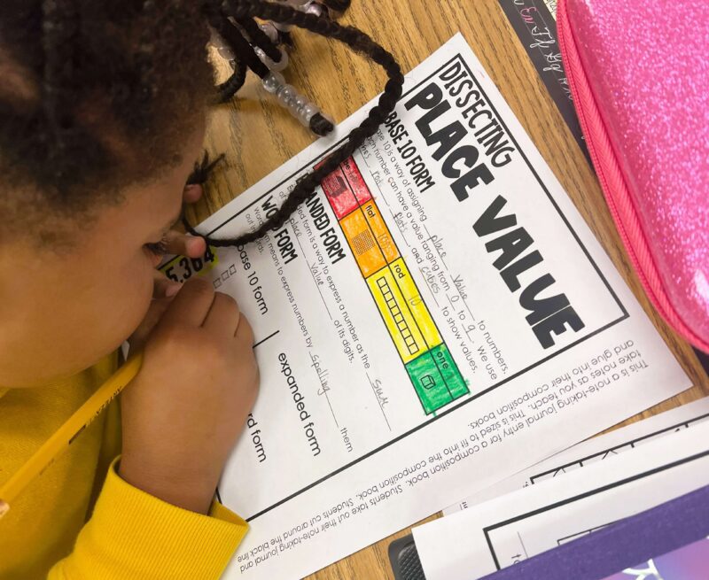 Student math note-taking dissecting place value 