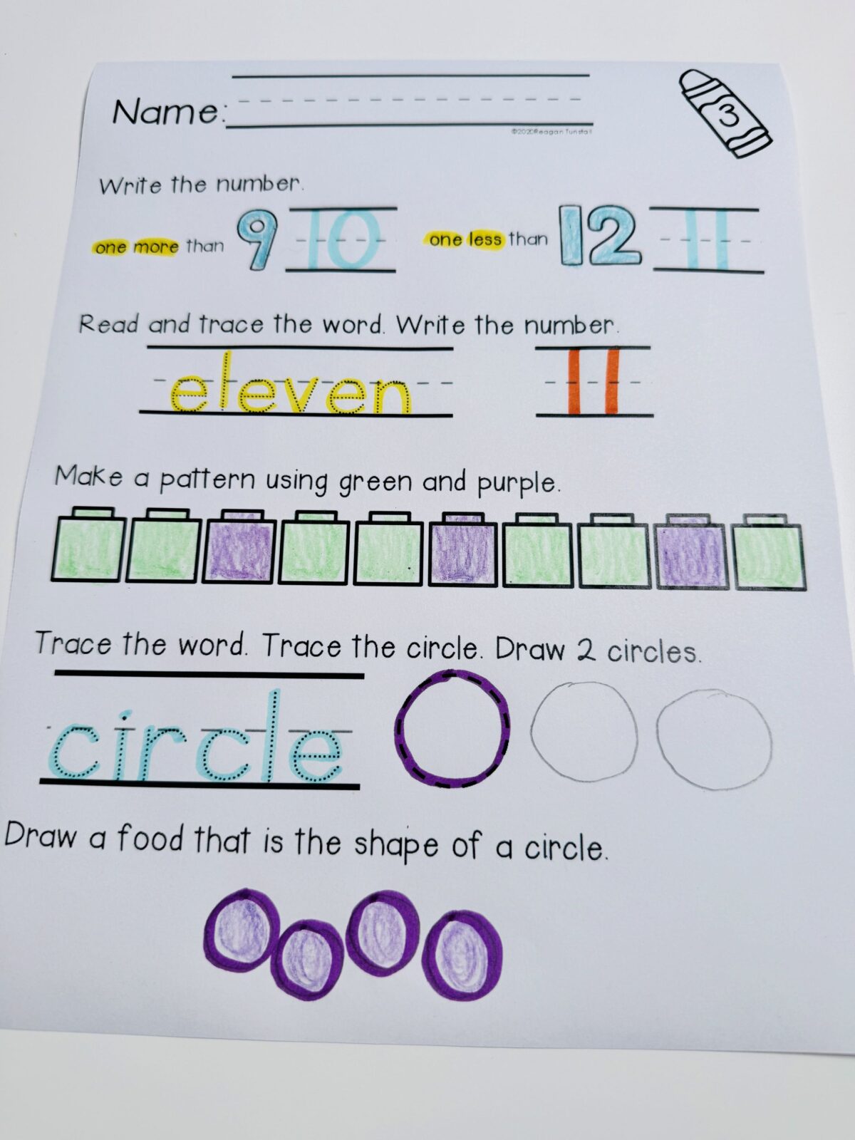 Kindergarten morning work math page featuring one more one less, number word tracing, AB pattern practice, and identifying circle shapes